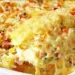 Dacă ți-a mai rămas orez fiert, atunci  pregătește neapărat această budincă, rumenă cu gust  apetisant de cașcaval, mozarella și șuncă